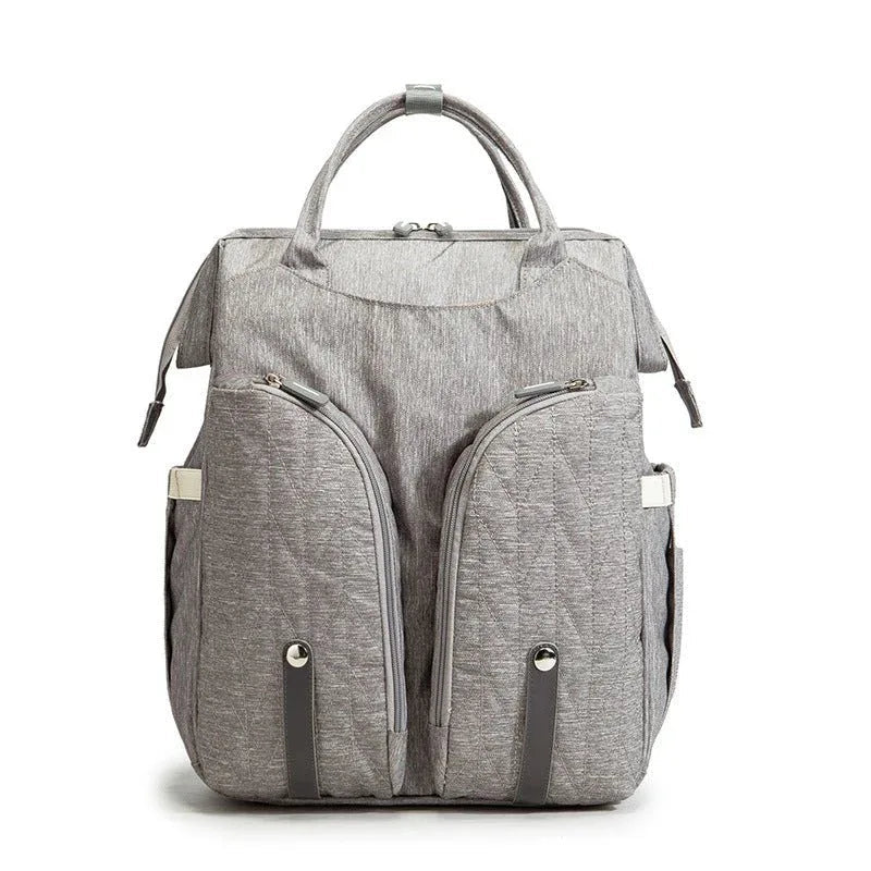 Tragbare Wickeltasche und Babybett